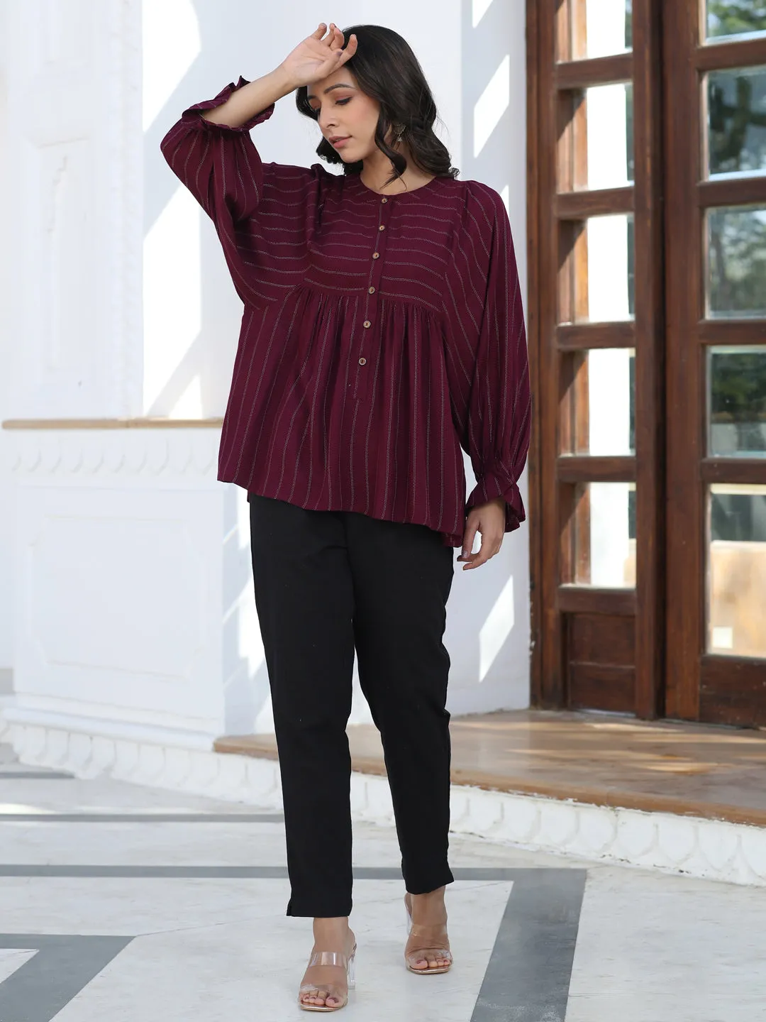 A Maroon Self Weave Rayon Lurex Gathered Top With Elasticated Gathered Sleeves With Black Pants